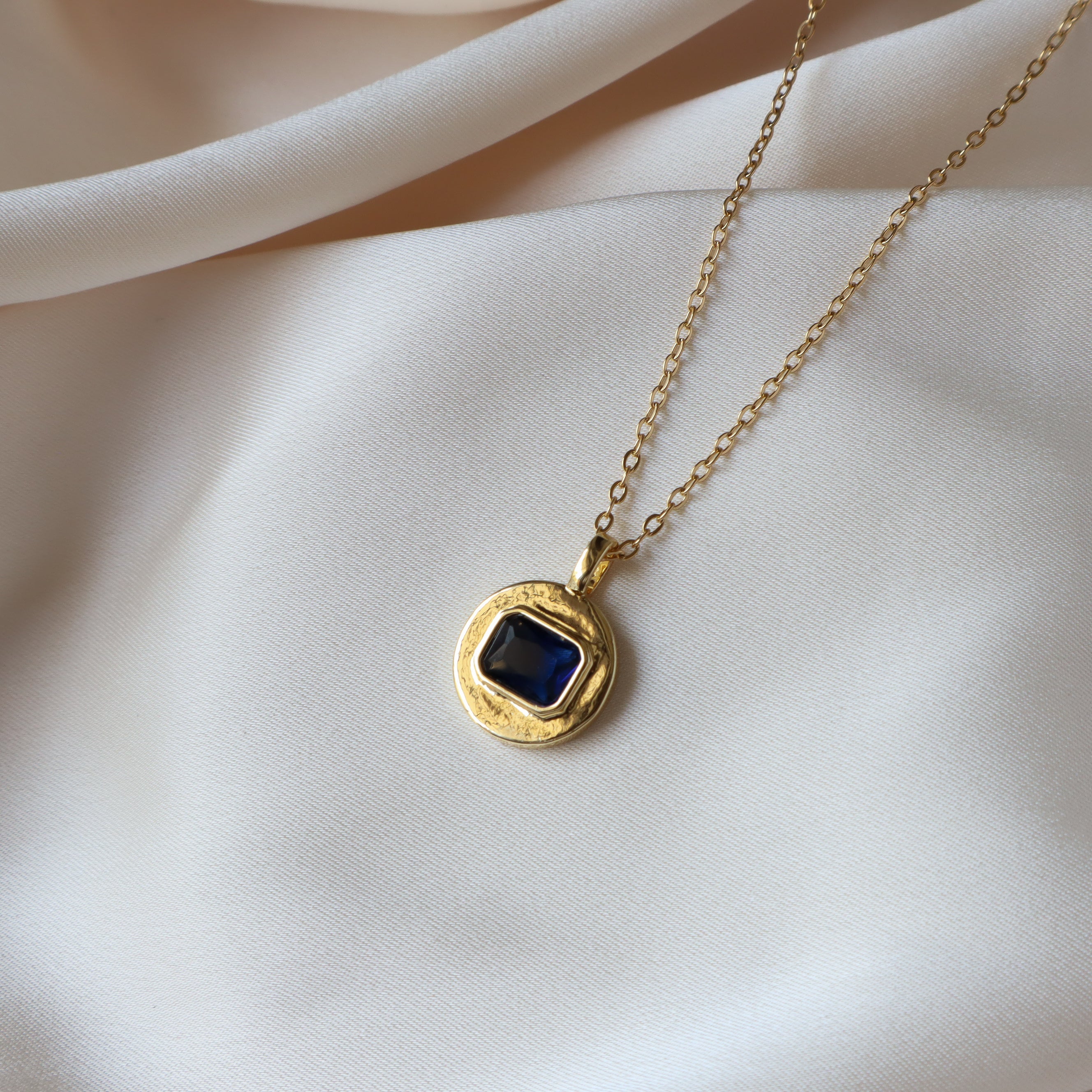 Gold Disc with Blue Stone Necklace